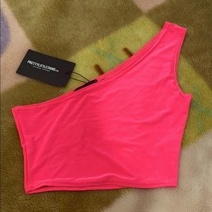 1 sleeve crop top, neon pink.